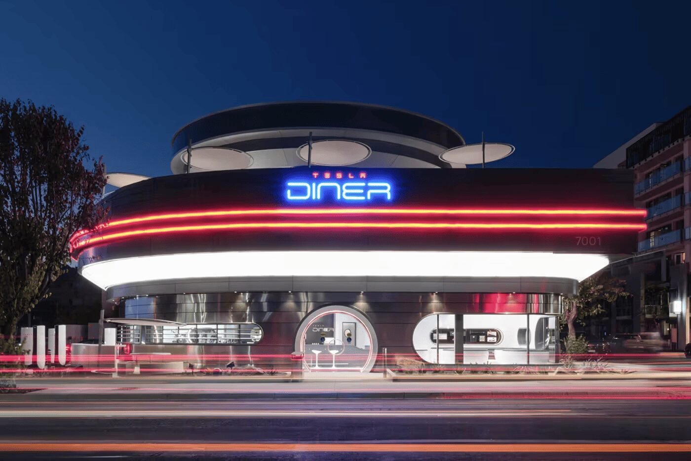 Tesla Diner glowing red neon strips at dusk